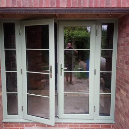 Chartwell Green PVCu French Doors with Astragal Bar and Side Screens for the Shutt's of Ta
