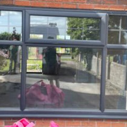 Anthracite Grey Storm PVCu Windows with integral Georgian Bar for the Westcotts in Bridgen