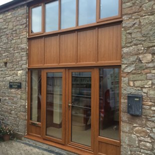 Double Height Barn Conversion Screen with Doors After in Duraflex PVCu Antique Golden Oak