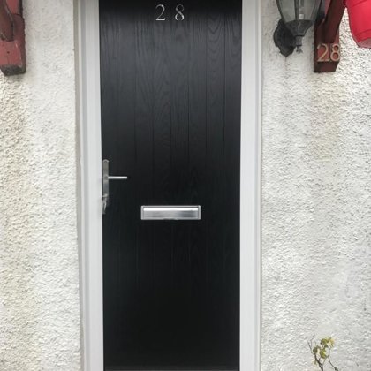 Black Slatted Contemporary Door with Gloss White Frame and Graphite Furniture installed in