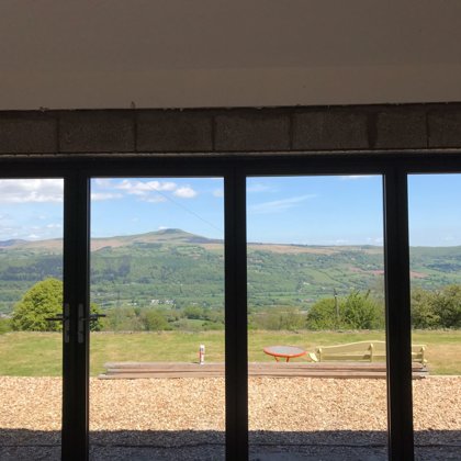 The Abbott-Swift, Gilwern 4 Section Wide-Span Bi-Folds overlooking the Sugarloaf Mountain