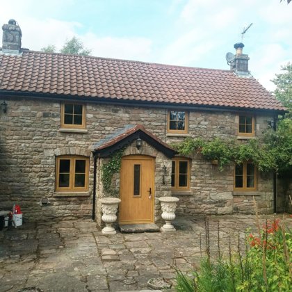 Mr and Mrs Pulling Chepstow Timesless Flush Casement Heritage Windows in Irish Oak PVCu