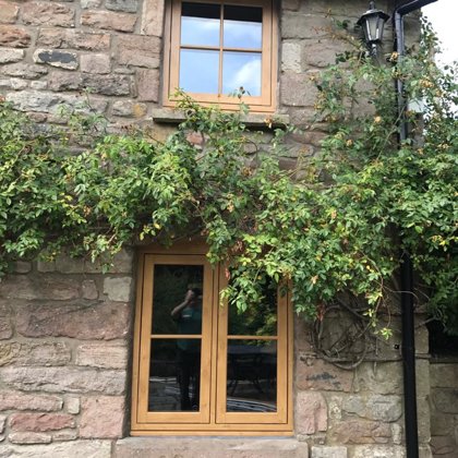 Mr and Mrs Pulling Chepstow Timesless Flush Casement Heritage Windows in Irish Oak PVCu