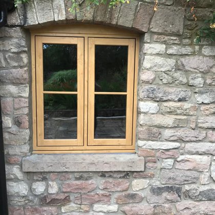 Mr and Mrs Pulling Chepstow Timesless Flush Casement Heritage Windows in Irish Oak PVCu