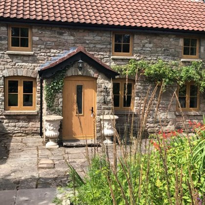 Mr and Mrs Pulling Chepstow Timesless Flush Casement Heritage Windows in Irish Oak PVCu