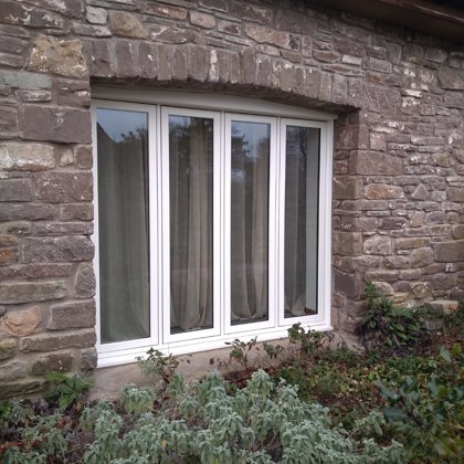 The Caswells Llanellen Timesless Flush Casement Heritage Windows in Woodgrain White PVCu