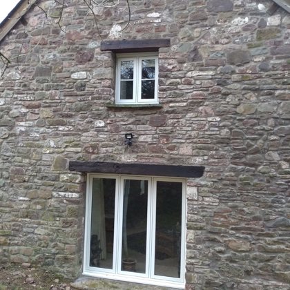 The Caswells Llanellen Timesless Flush Casement Heritage Windows in Woodgrain White PVCu