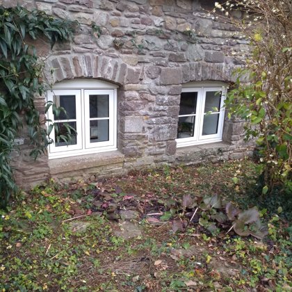 The Caswells Llanellen Timesless Flush Casement Heritage Windows in Woodgrain White PVCu
