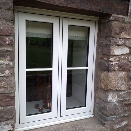 The Caswells Llanellen Timesless Flush Casement Heritage Windows in Woodgrain White PVCu