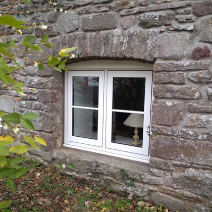 The Caswells Llanellen Timesless Flush Casement Heritage Windows in Woodgrain White PVCu