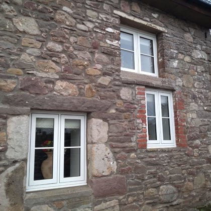 The Caswells Llanellen Timesless Flush Casement Heritage Windows in Woodgrain White PVCu