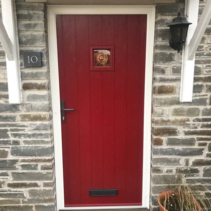 Traditional Red Cottage Door with Textured White Frame installed in Llangattock for the Pu