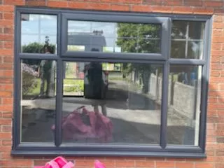Anthracite Grey Storm PVCu Windows with integral Georgian Bar for the Westcotts in Bridgen