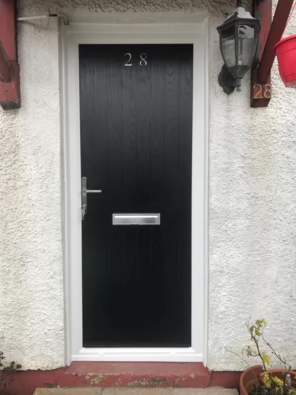 Black Slatted Contemporary Door with Gloss White Frame and Graphite Furniture installed in
