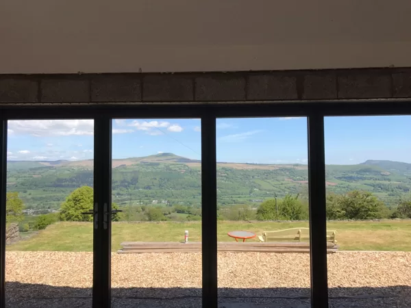 The Abbott-Swift, Gilwern 4 Section Wide-Span Bi-Folds overlooking the Sugarloaf Mountain