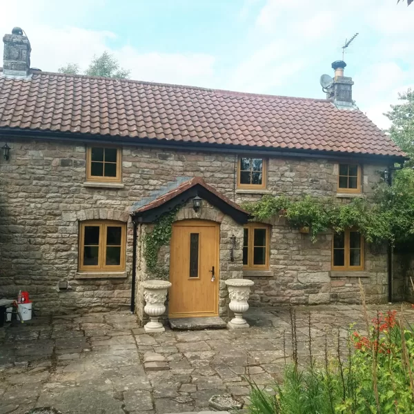 Mr and Mrs Pulling Chepstow Timesless Flush Casement Heritage Windows in Irish Oak PVCu