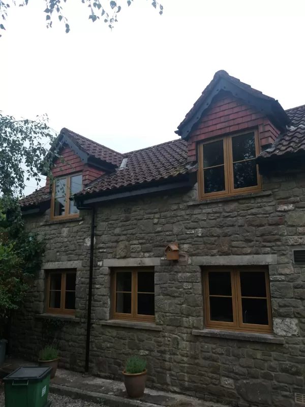 Mr and Mrs Pulling Chepstow Timesless Flush Casement Heritage Windows in Irish Oak PVCu
