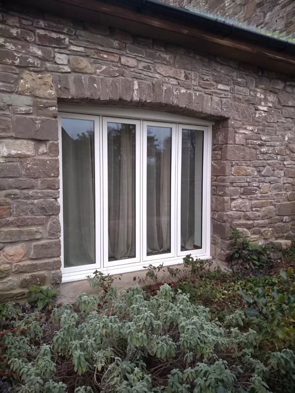 The Caswells Llanellen Timesless Flush Casement Heritage Windows in Woodgrain White PVCu