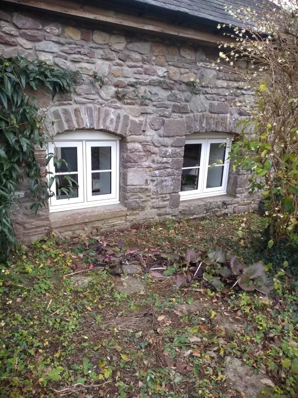 The Caswells Llanellen Timesless Flush Casement Heritage Windows in Woodgrain White PVCu
