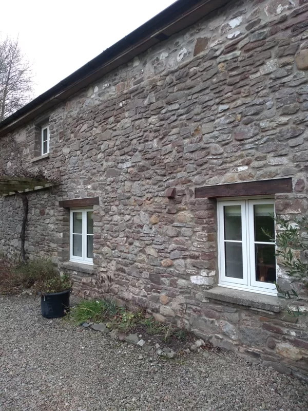 The Caswells Llanellen Timesless Flush Casement Heritage Windows in Woodgrain White PVCu