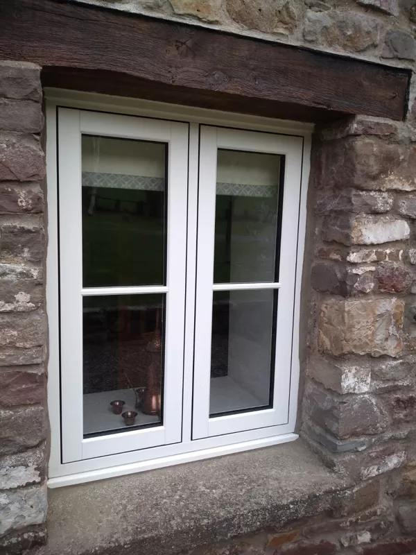 The Caswells Llanellen Timesless Flush Casement Heritage Windows in Woodgrain White PVCu