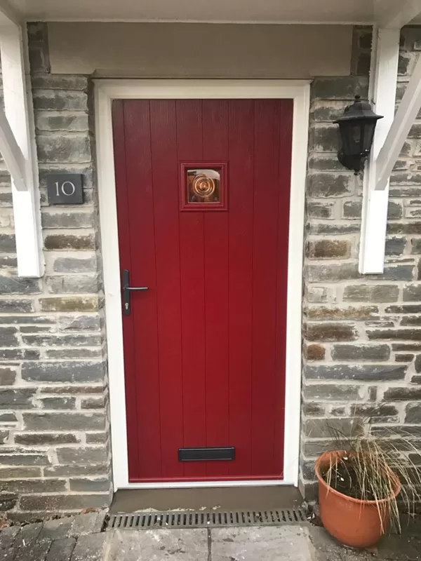 Traditional Red Cottage Door with Textured White Frame installed in Llangattock for the Pu