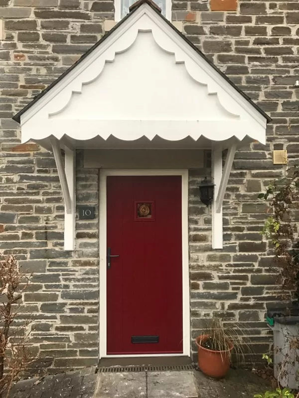 Traditional Red Cottage Door with Textured White Frame installed in Llangattock for the Pu
